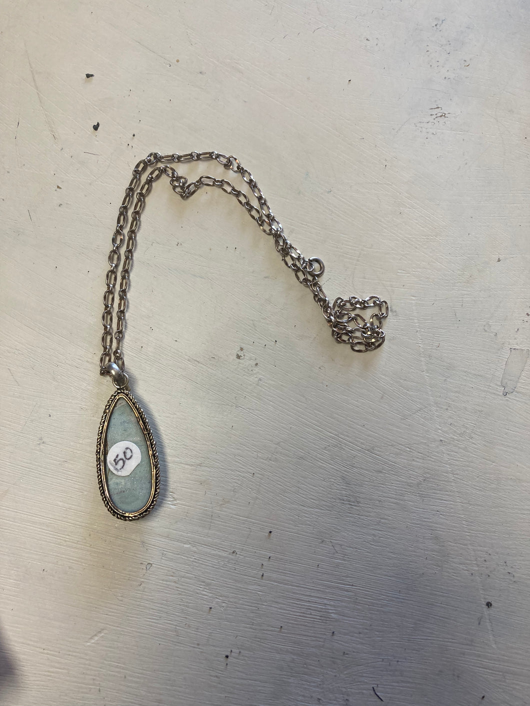 Bronze necklace with blue stone pendant